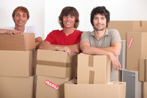Commercial removals crew transporting office equipment in North London