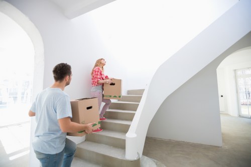 Loading household furniture into a removal truck in Kentish Town
