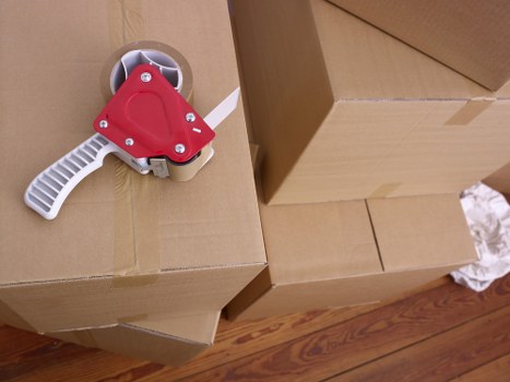 Loading boxes and household items into a van for a Kentish Town move