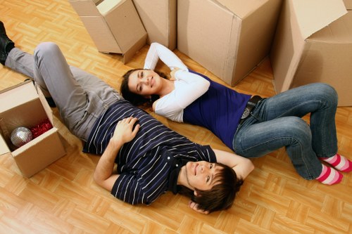 Mover handling boxes carefully during a house relocation