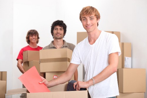 Local office relocation team handling furniture in Kentish Town
